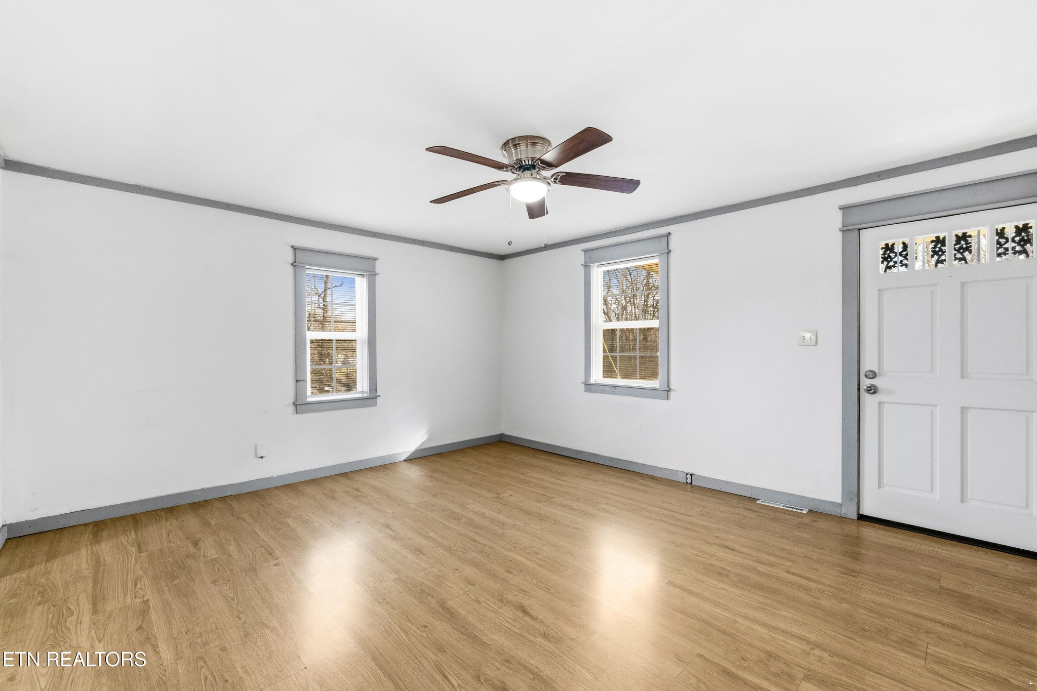 2438 Southside Road Knoxville, TN 37920 - Photo 4 of 21 a view of a room with wooden floor and windows