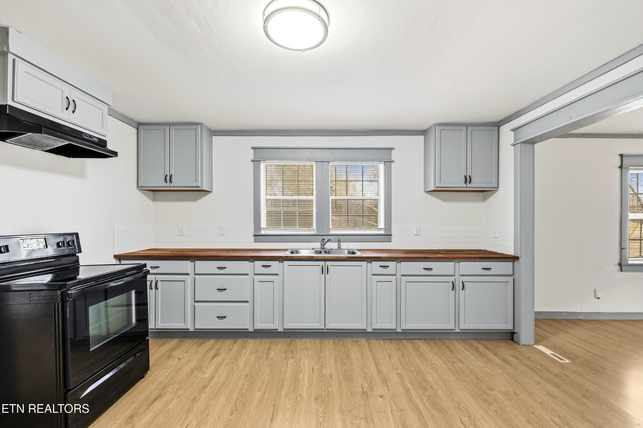 2438 Southside Road Knoxville, TN 37920 - Photo 9 of 21 a kitchen with granite countertop a sink cabinets and stainless steel appliances