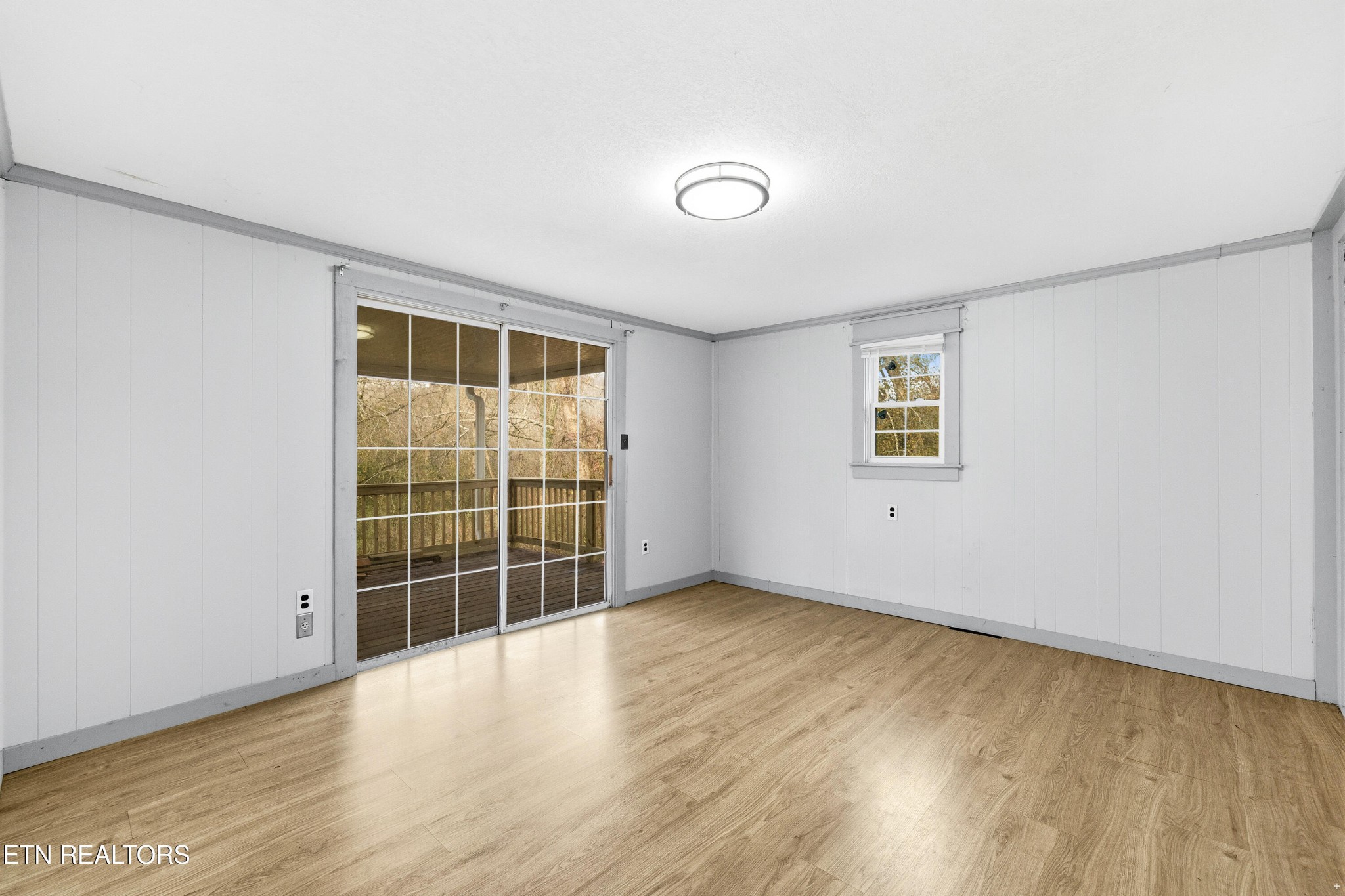 2438 Southside Road Knoxville, TN 37920 - Photo 10 of 21 an empty room with wooden floor and windows