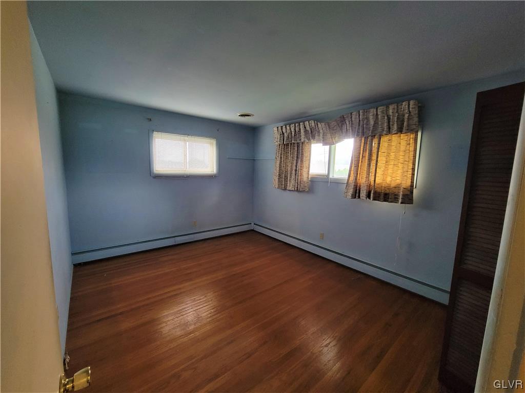 1312 5th Street Whitehall, PA 18052 - Photo 16 of 29 an empty room with wooden floor and windows