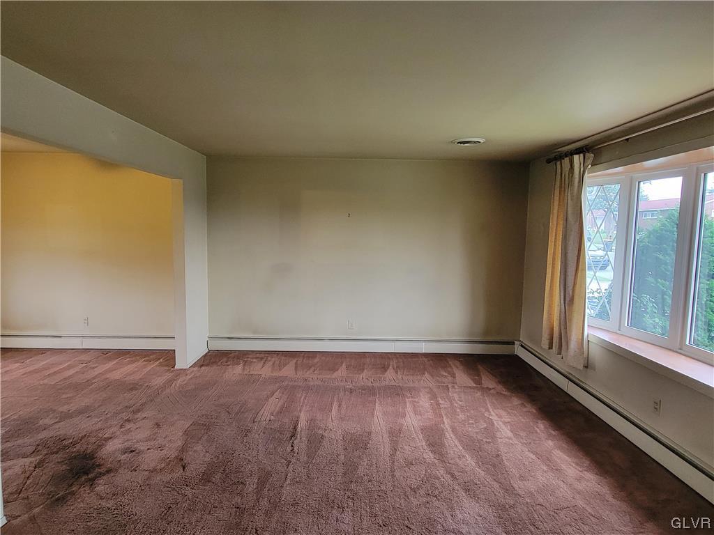 1312 5th Street Whitehall, PA 18052 - Photo 20 of 29 an empty room with wooden floor and windows