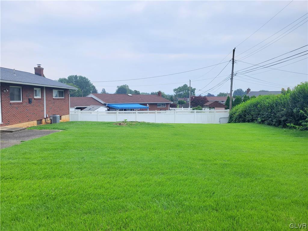 1312 5th Street Whitehall, PA 18052 - Photo 28 of 29 a view of a house with a big yard and a large tree