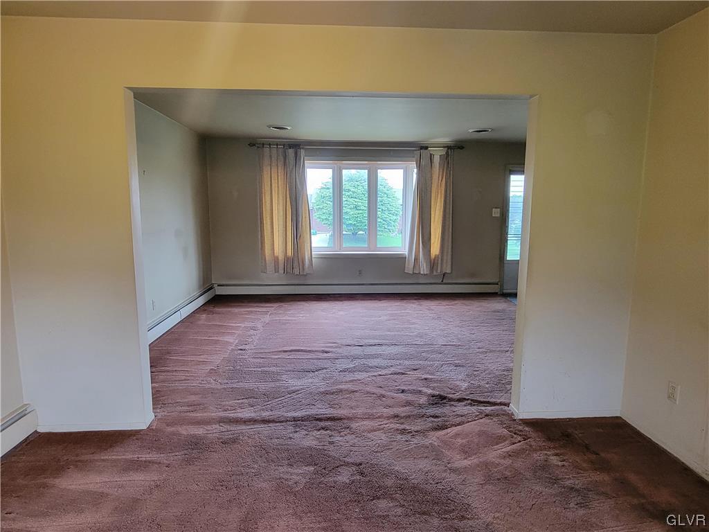 1312 5th Street Whitehall, PA 18052 - Photo 8 of 29 an empty room with wooden floor and a window