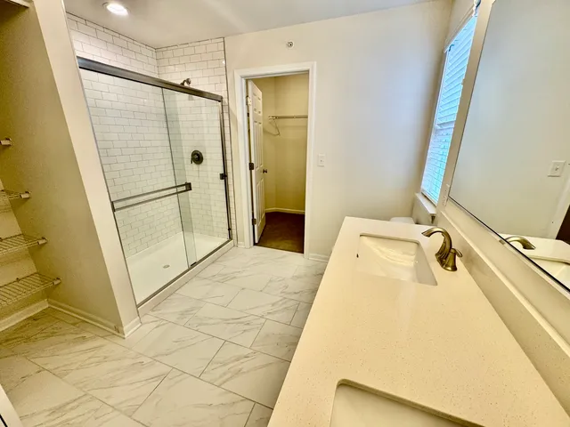 a bathroom with a tub sink and shower