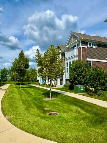 a backyard of a house with lots of green space