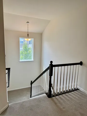 a view of a hallway with windows