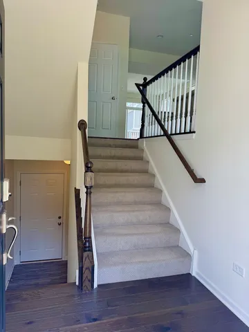 a view of entryway with wooden floor