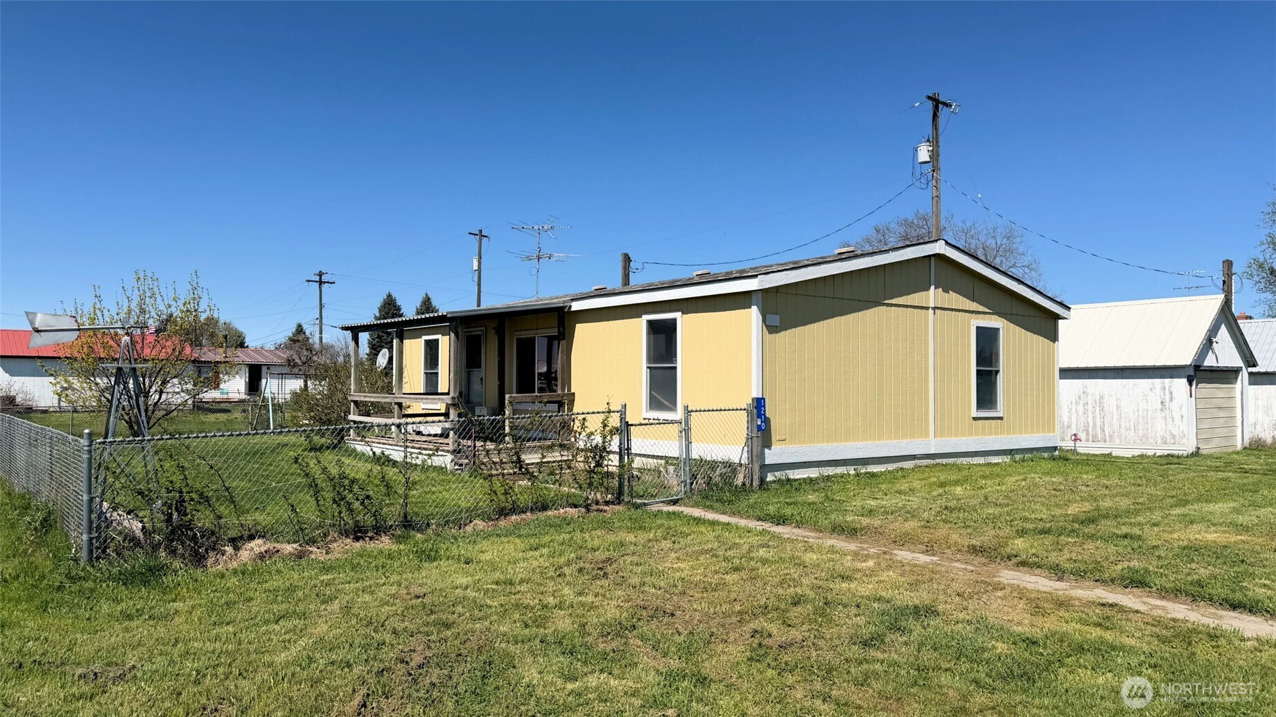 1210 2nd Street Davenport, WA 99122 - Photo 2 of 19 a view of a backyard with potted plants