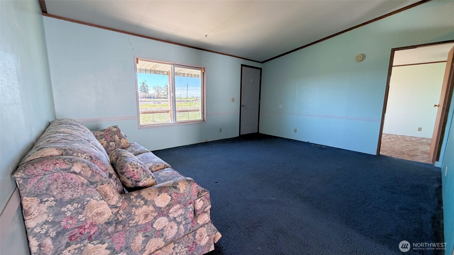 1210 2nd Street Davenport, WA 99122 - Photo 4 of 19 a bed sitting in a bedroom next to a window