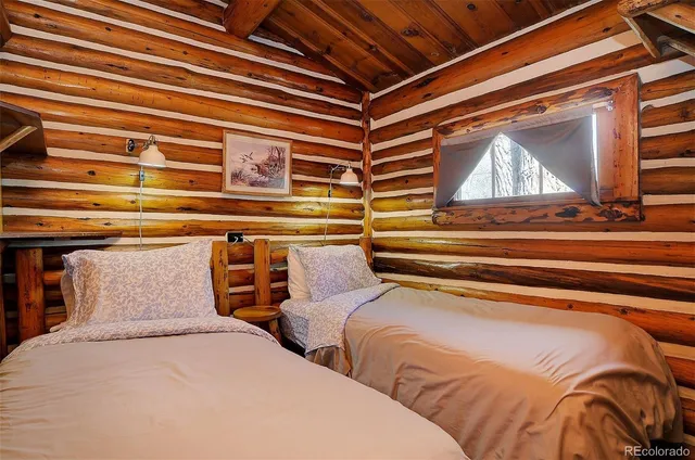 a view of bed and wooden floor