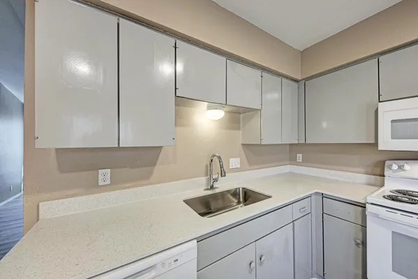 a kitchen with a sink and cabinets