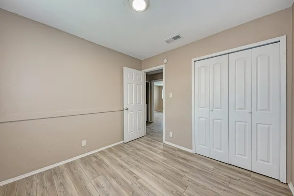 a view of a livingroom with wooden floor