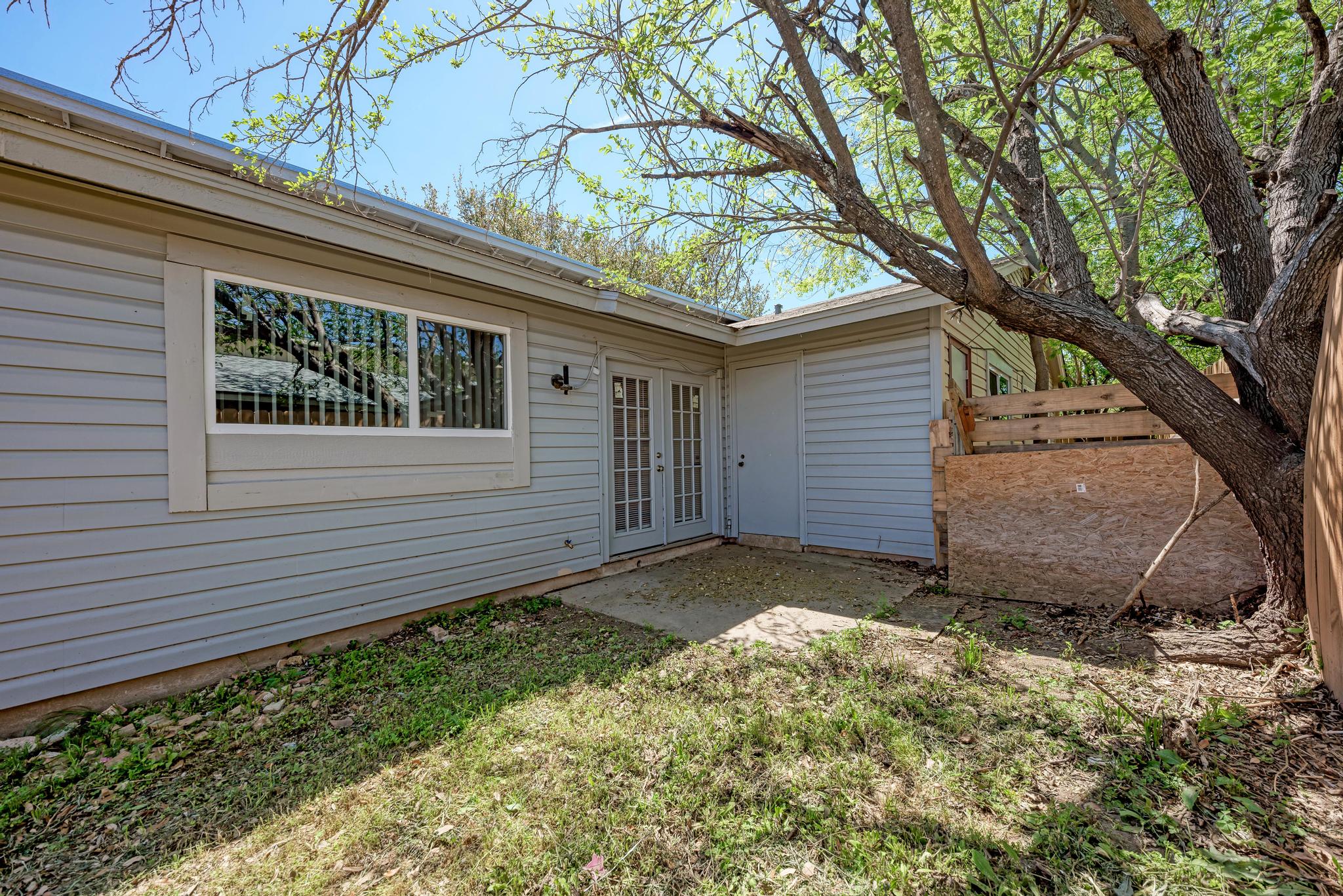 1117 West Rundberg Lane, Unit A Austin, TX 78758 - Photo 26 of 31 View of exterior entry featuring french doors and a patio