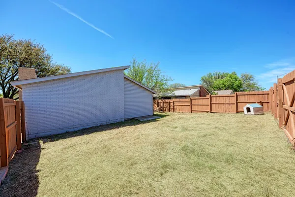 a view of backyard and tree