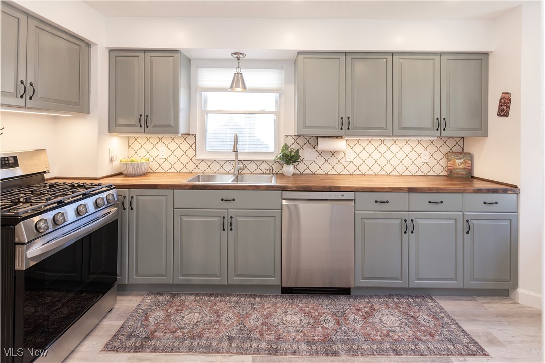 2783 Hampton Road Rocky River, OH 44116 - Photo 12 of 41 Stunning refinished cabinetry with butcher block countertops!