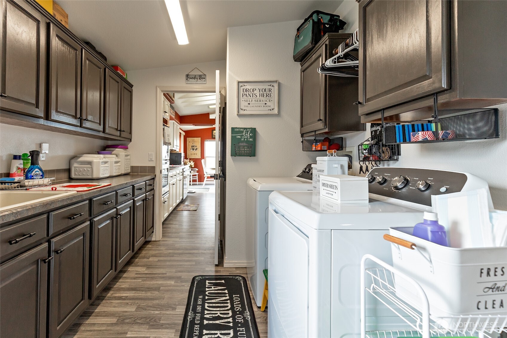 2416 Clerf Road Ellensburg, WA 98926 - Photo 11 of 35 a kitchen with stainless steel appliances granite countertop a sink dishwasher stove and refrigerator