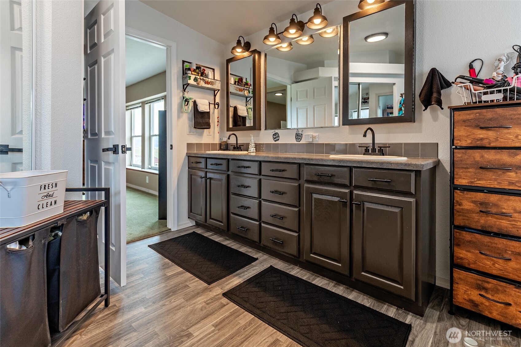 2416 Clerf Road Ellensburg, WA 98926 - Photo 17 of 35 a spacious bathroom with a double vanity sink a mirror and shower