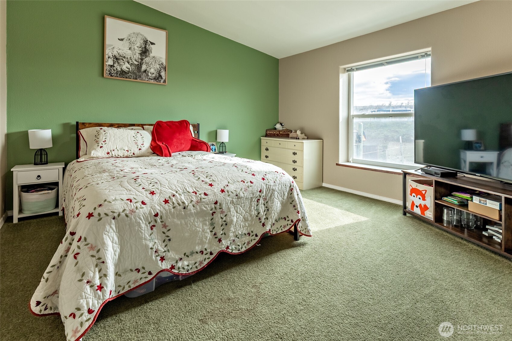 2416 Clerf Road Ellensburg, WA 98926 - Photo 20 of 35 a bedroom with a bed and a flat tv screen on the dresser