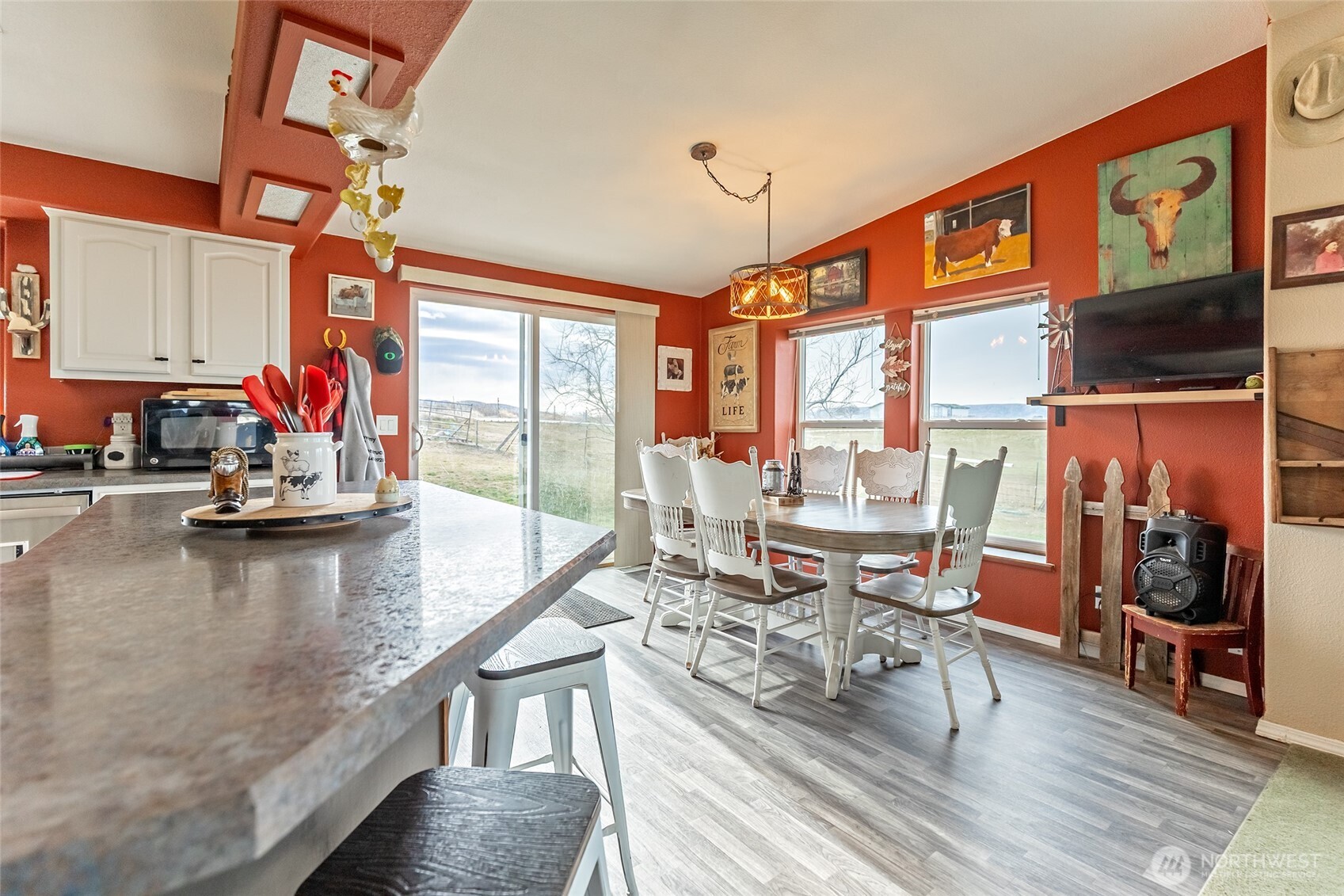 2416 Clerf Road Ellensburg, WA 98926 - Photo 7 of 35 a living room with furniture a flat screen tv and floor to ceiling window