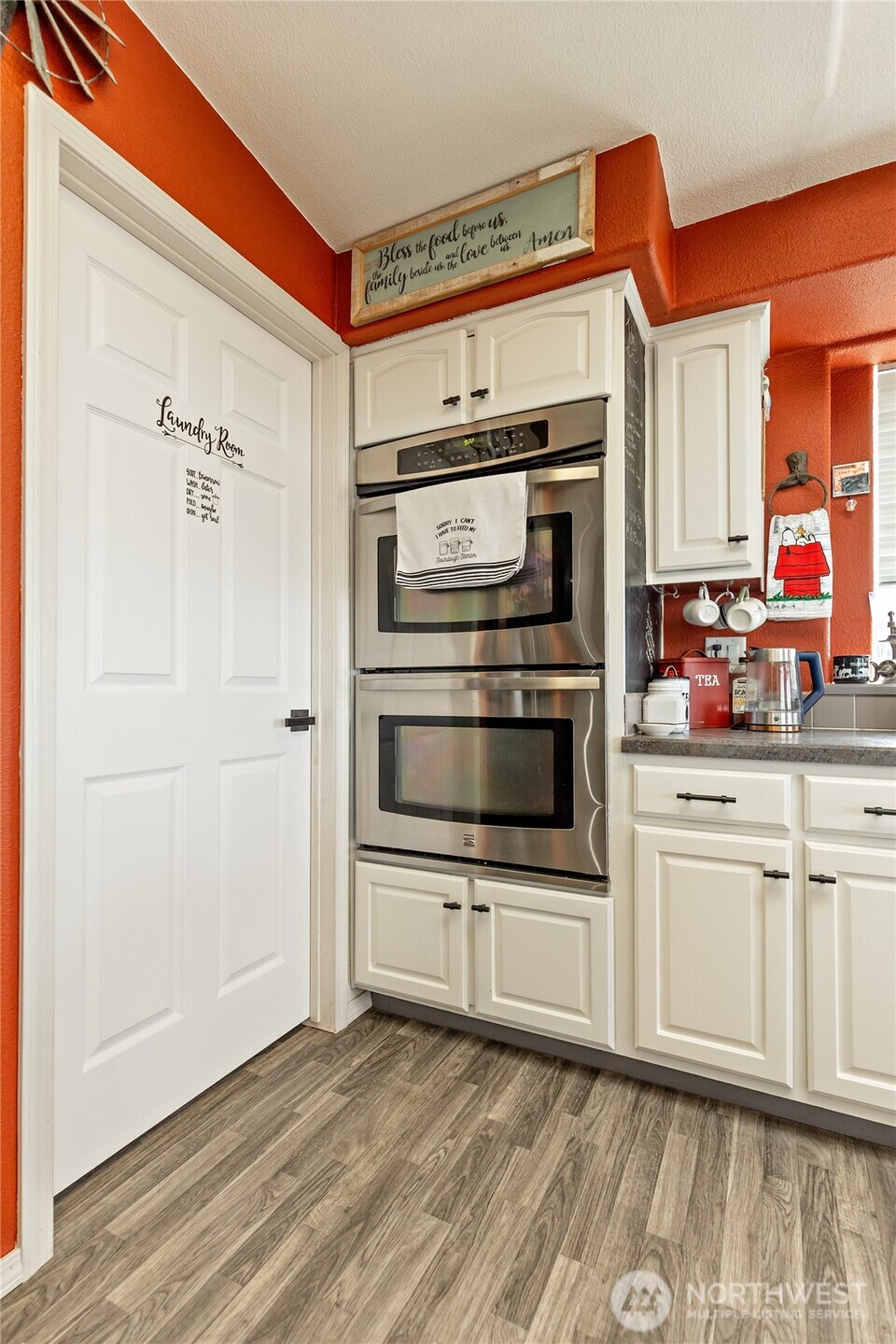 2416 Clerf Road Ellensburg, WA 98926 - Photo 10 of 35 a kitchen with stainless steel appliances a stove a microwave and cabinets