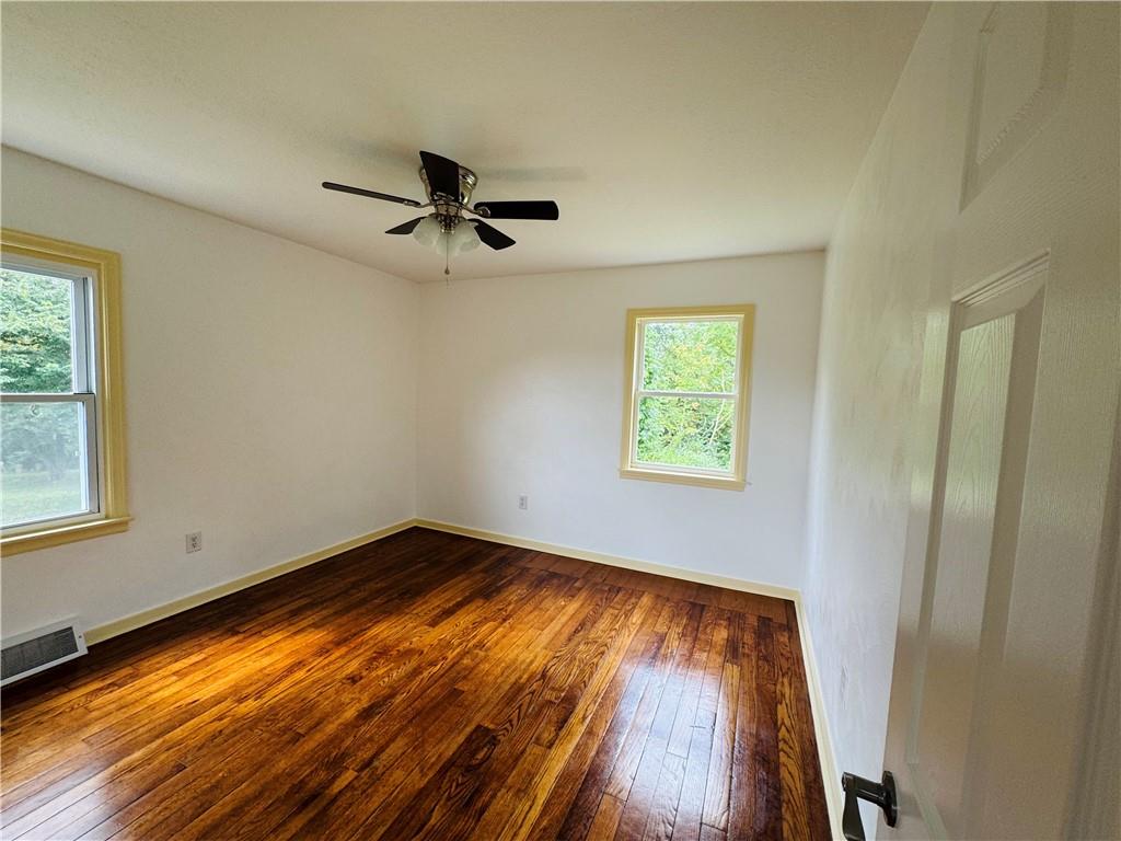 1248 Saltsburg Road Export, PA 15632 - Photo 11 of 44 wooden floor in an empty room with a window