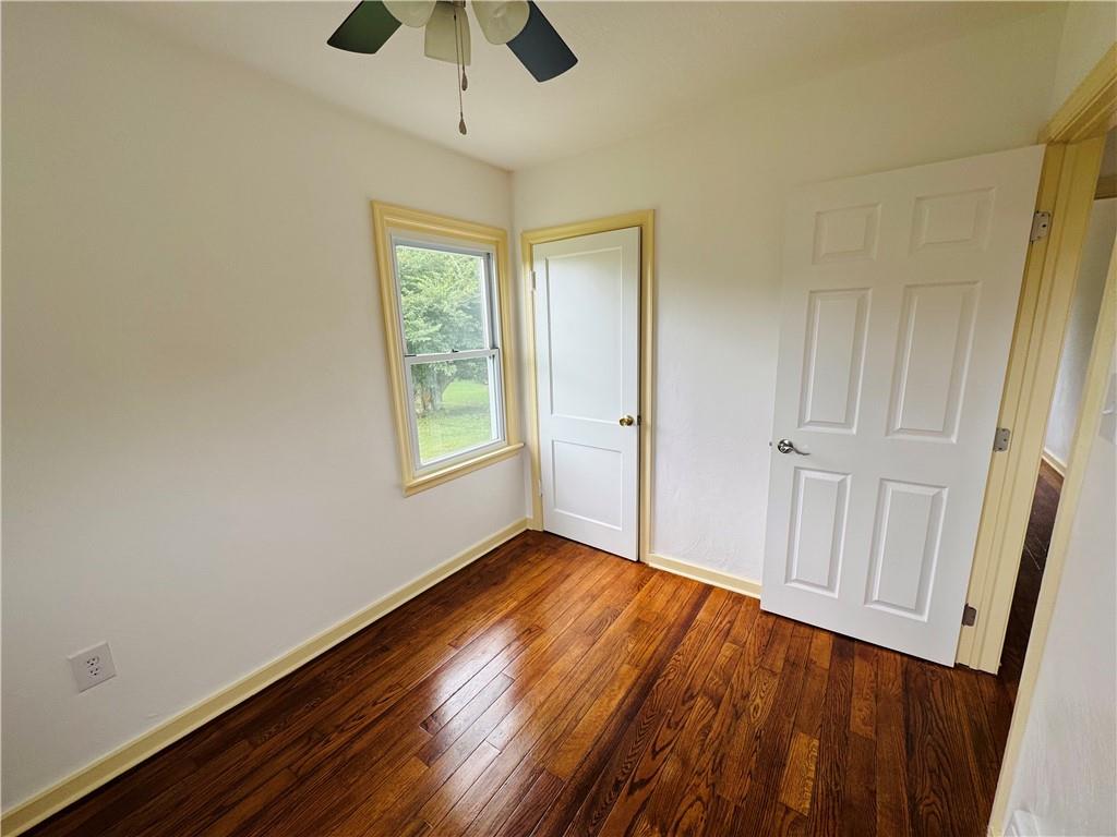 1248 Saltsburg Road Export, PA 15632 - Photo 17 of 44 an empty room with wooden floor cabinet and windows