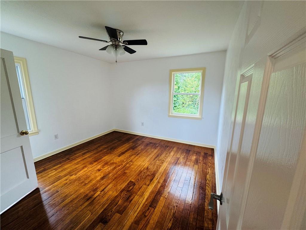 1248 Saltsburg Road Export, PA 15632 - Photo 18 of 44 a view of empty room with wooden floor and fan
