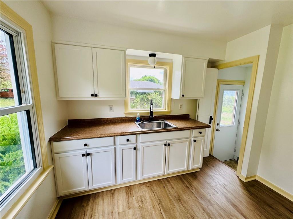 1248 Saltsburg Road Export, PA 15632 - Photo 6 of 44 a kitchen with stainless steel appliances a sink window and cabinets