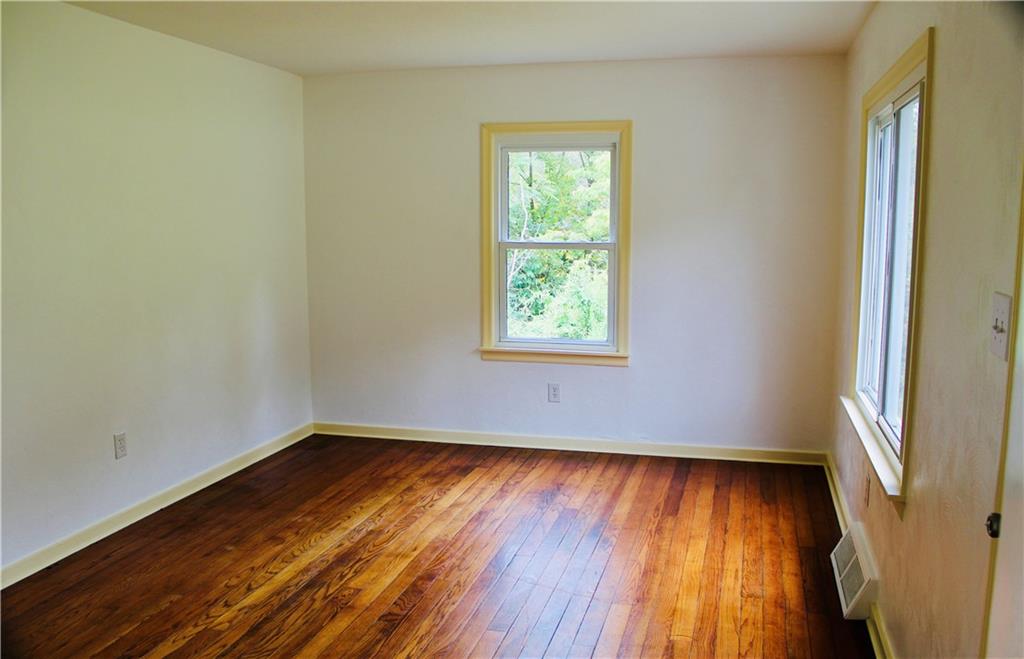 1248 Saltsburg Road Export, PA 15632 - Photo 9 of 44 an empty room with wooden floor and windows
