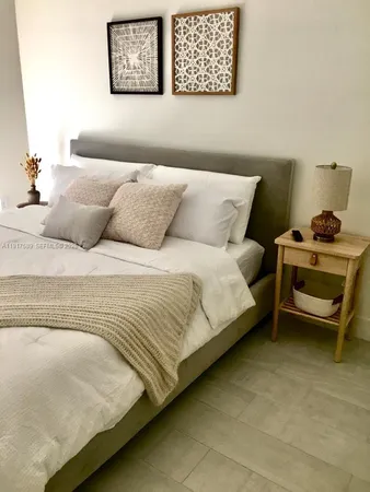 a bedroom with a bed and a couch