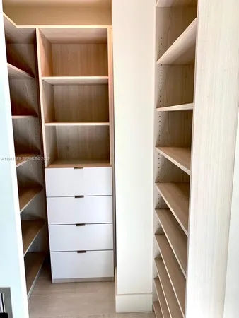 a view of an empty walk in closet