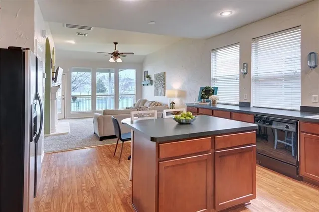 a kitchen with stainless steel appliances granite countertop a stove and a refrigerator