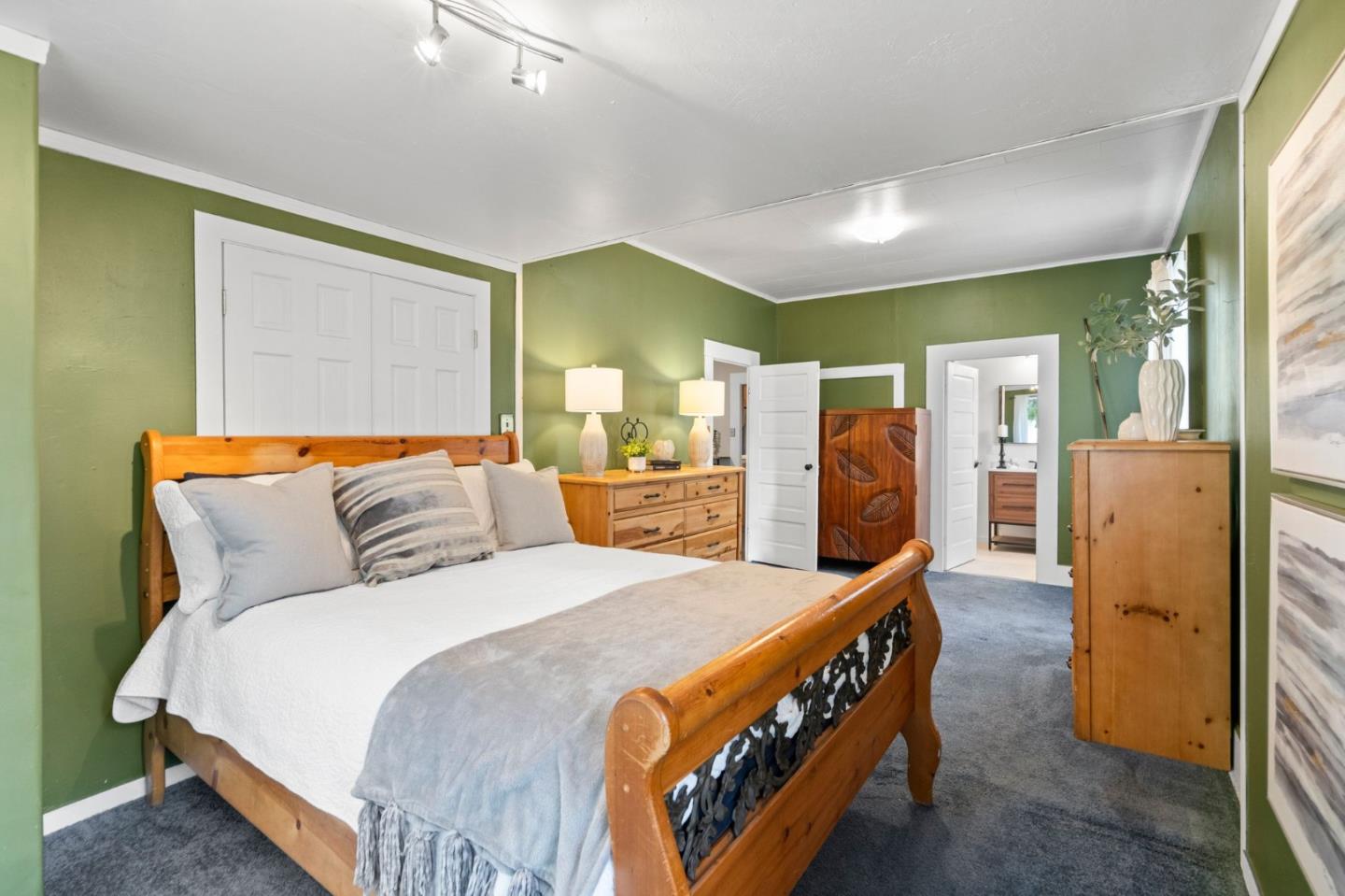 269 Marcus Street Aromas, CA 95004 - Photo 12 of 18 a bedroom with a bed and wooden floor