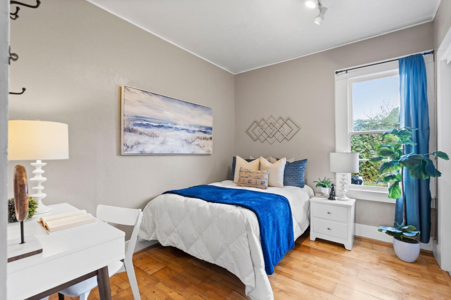 269 Marcus Street Aromas, CA 95004 - Photo 14 of 18 a bed room with a bed and a potted plant
