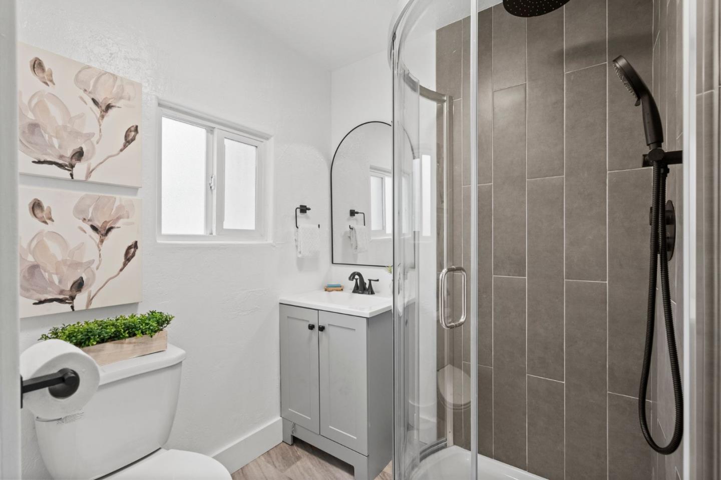 269 Marcus Street Aromas, CA 95004 - Photo 15 of 18 a bathroom with a shower sink mirror and toilet