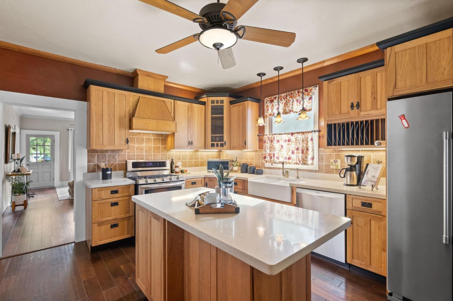 269 Marcus Street Aromas, CA 95004 - Photo 7 of 18 a kitchen with a stove a sink a dining table and chairs