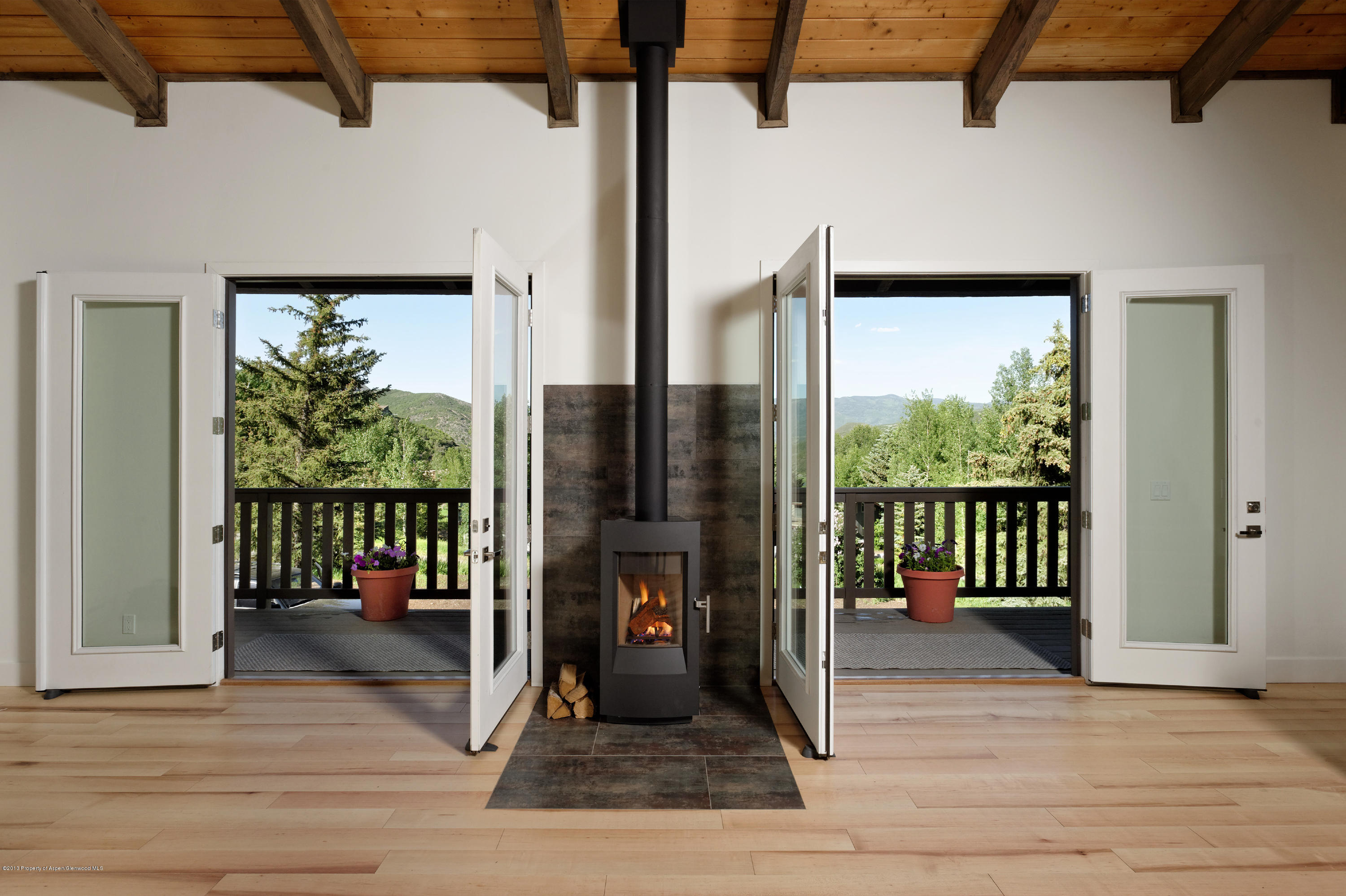 222 Meadow Road Snowmass Village, CO 81615 - Photo 20 of 21 Wood Stove/ French Doors