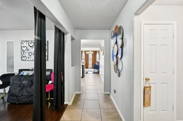 a living room with furniture and a closet