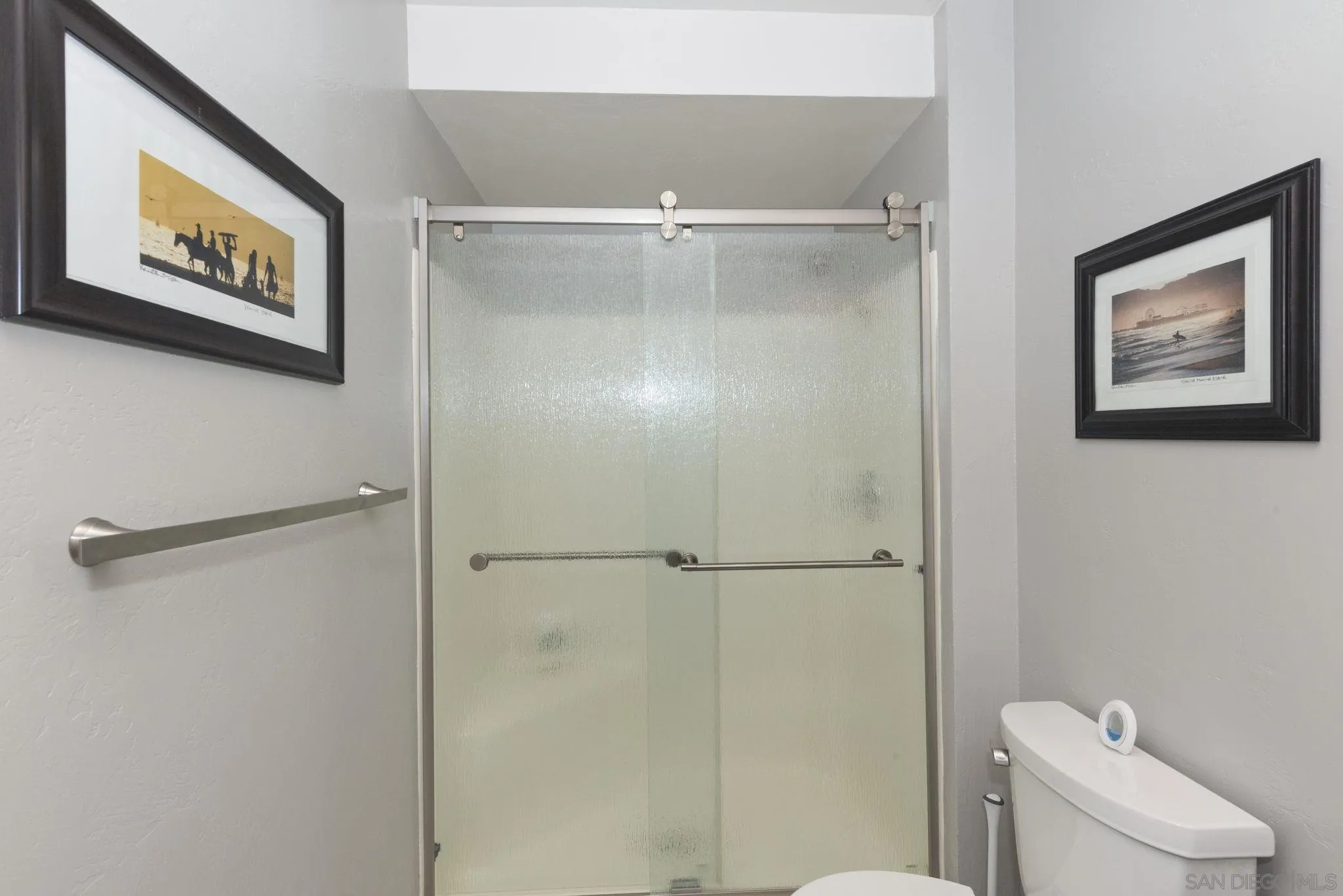 17617 Pomerado Road, Unit 112 San Diego, CA 92128 - Photo 15 of 26 a bathroom with a shower and a toilet in it