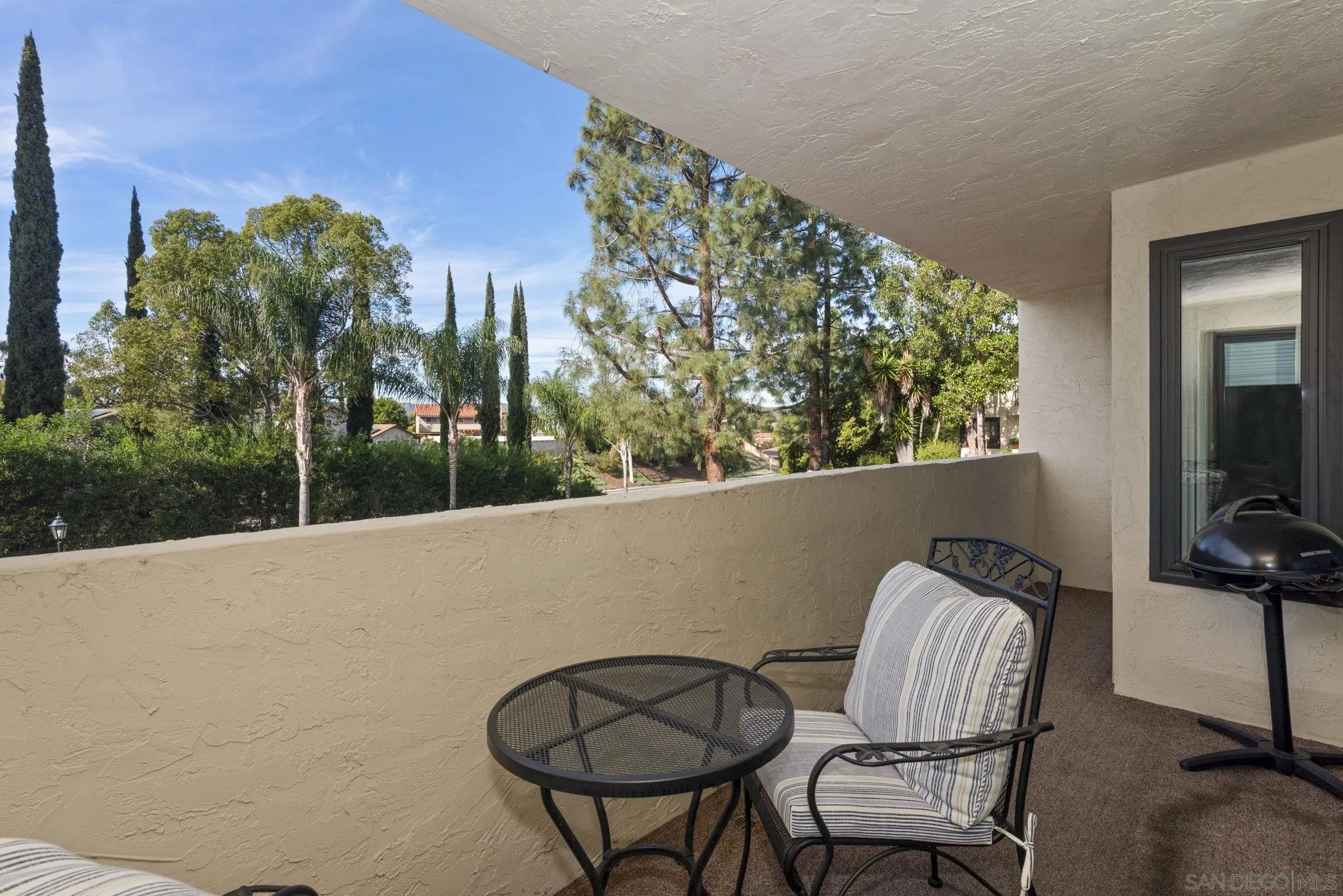 17617 Pomerado Road, Unit 112 San Diego, CA 92128 - Photo 17 of 26 a view of balcony with furniture and a potted plant