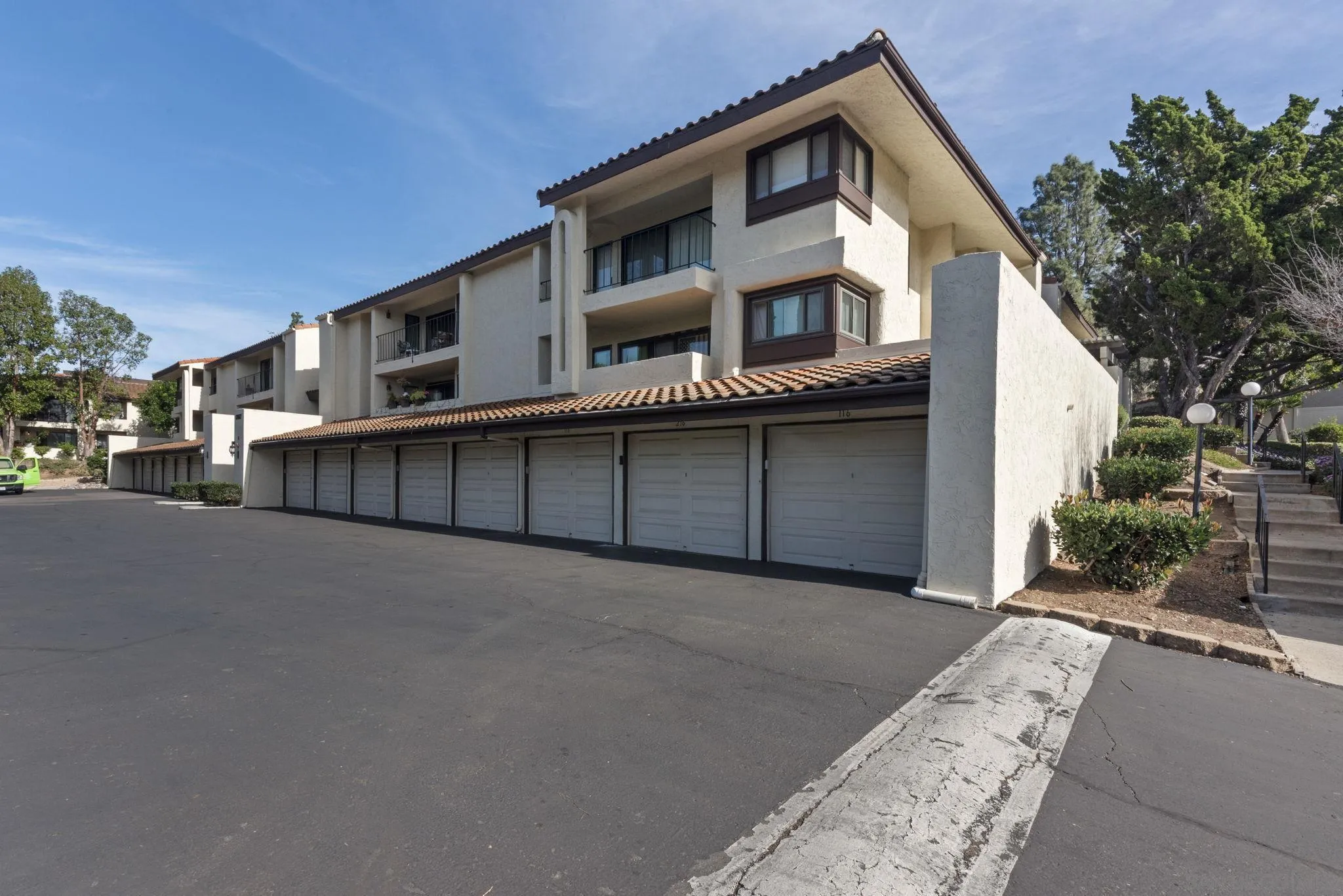17617 Pomerado Road, Unit 112 San Diego, CA 92128 - Photo 22 of 26 a front view of a house with a street