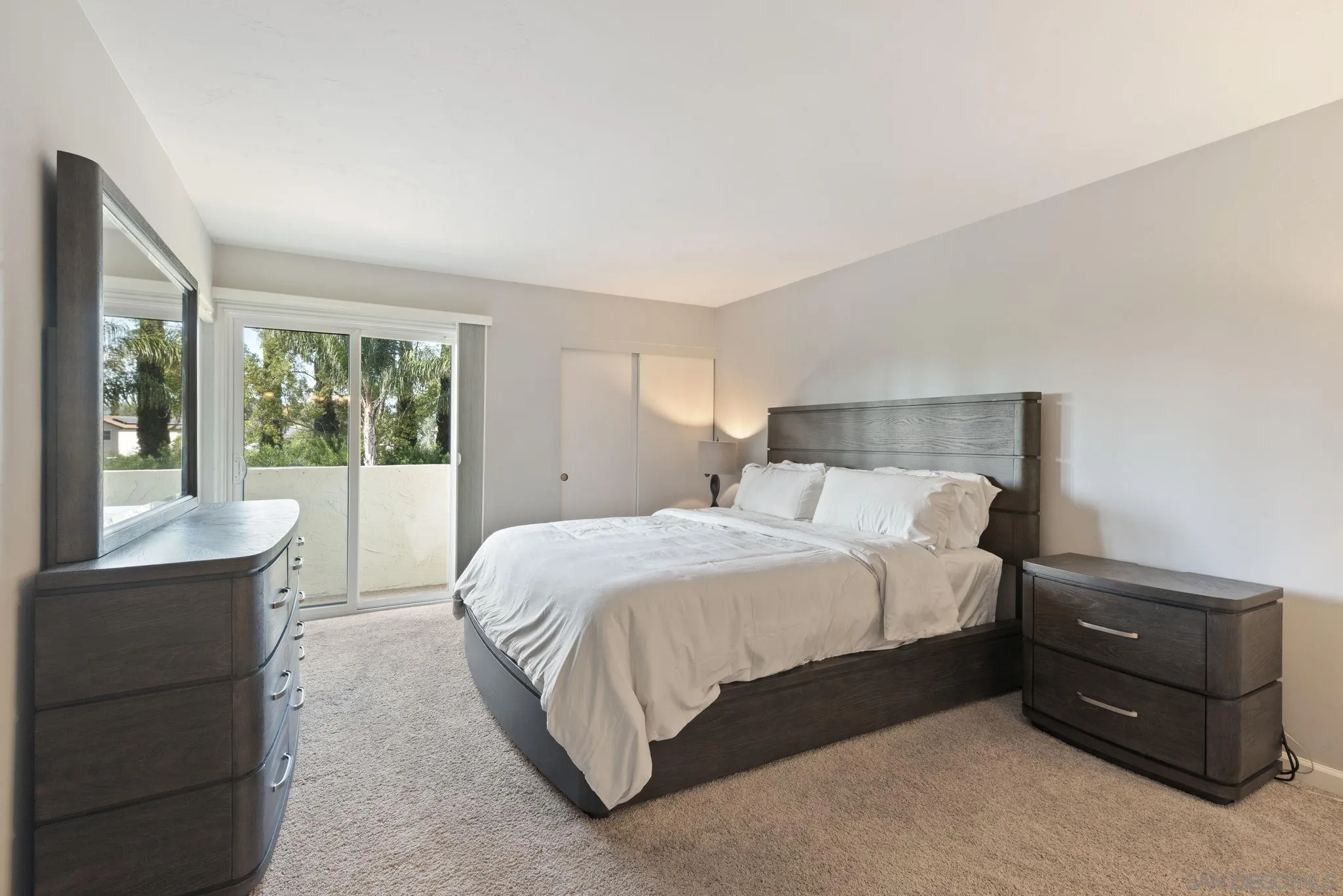 17617 Pomerado Road, Unit 112 San Diego, CA 92128 - Photo 7 of 26 a bedroom with a bed and wooden floor