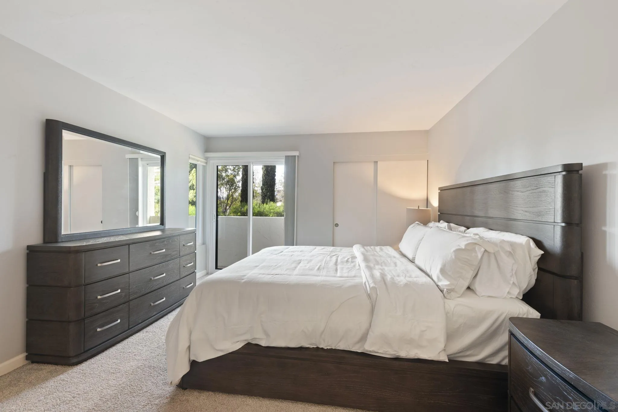 17617 Pomerado Road, Unit 112 San Diego, CA 92128 - Photo 8 of 26 a bedroom with a bed and a dresser