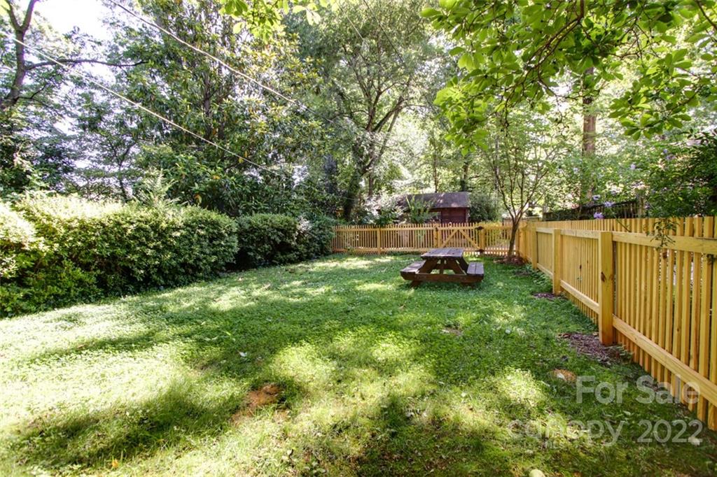2123 Park Road Charlotte, NC 28203 - Photo 11 of 13 a green field with trees in the background