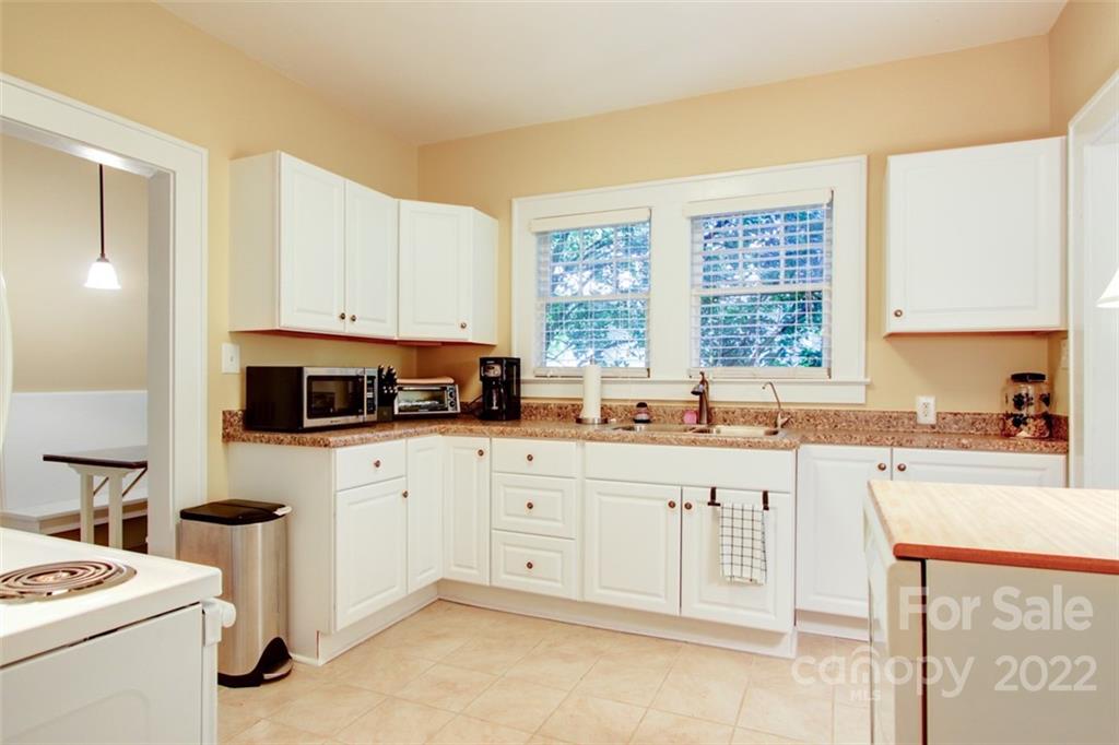 2123 Park Road Charlotte, NC 28203 - Photo 7 of 13 a kitchen with appliances a sink and a counter space