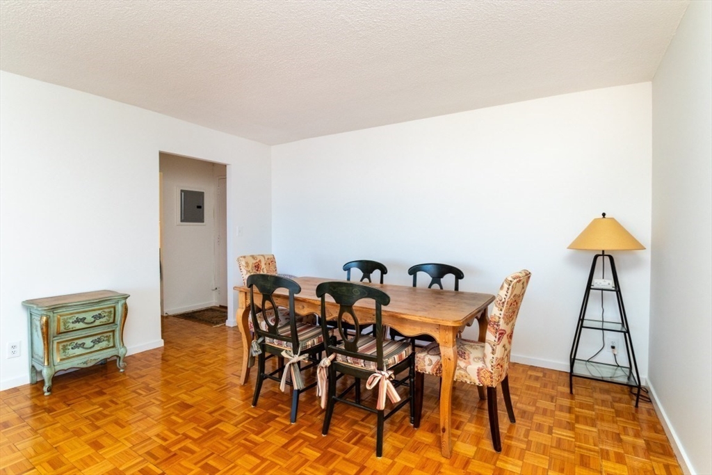 33 Pond Avenue, Unit 1106 Brookline, MA 02445 - Photo 12 of 32 a view of a dining room with furniture