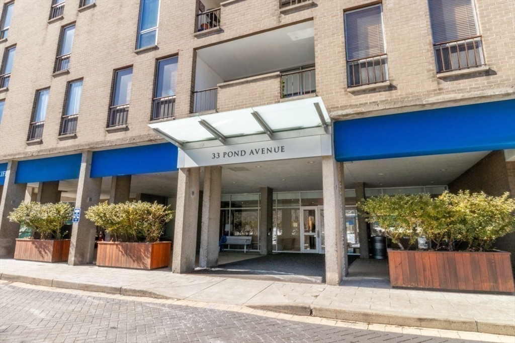 33 Pond Avenue, Unit 1106 Brookline, MA 02445 - Photo 2 of 32 a view of a building with a bench and windows