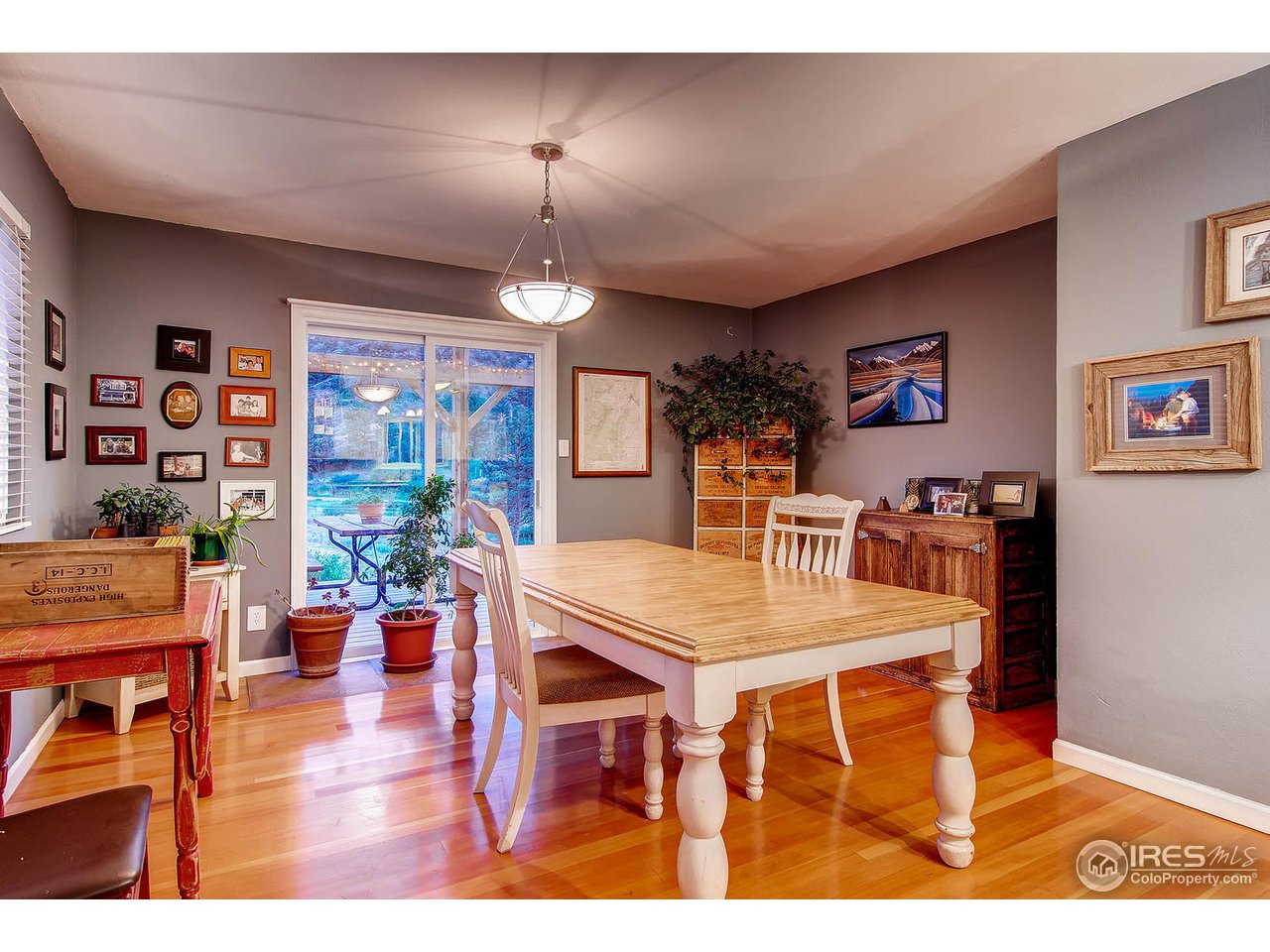 427 Red Gulch Road Lyons, CO 80540 - Photo 11 of 25 a view of a dining room with furniture and wooden floor