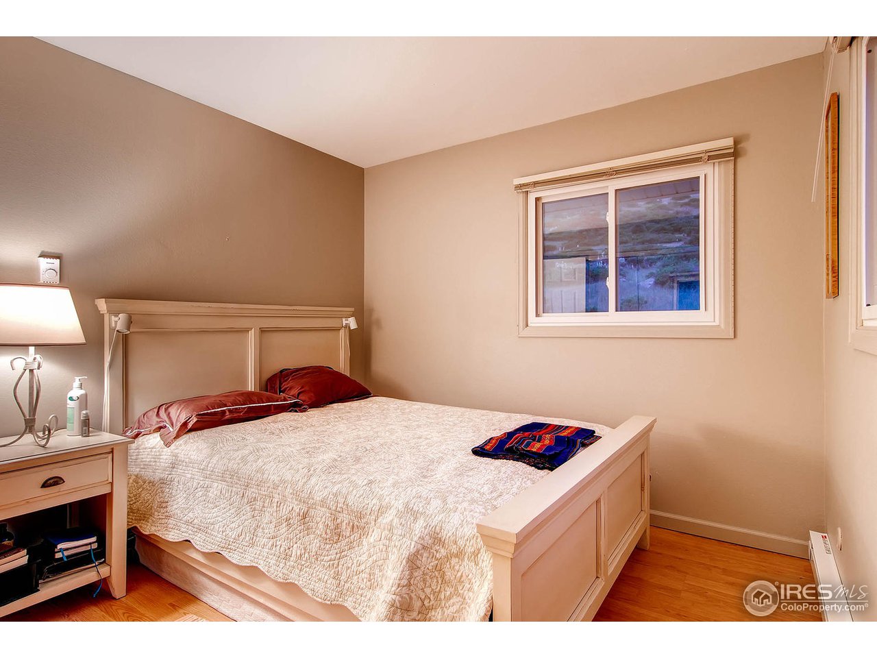 427 Red Gulch Road Lyons, CO 80540 - Photo 15 of 25 a bedroom with a bed and a dresser