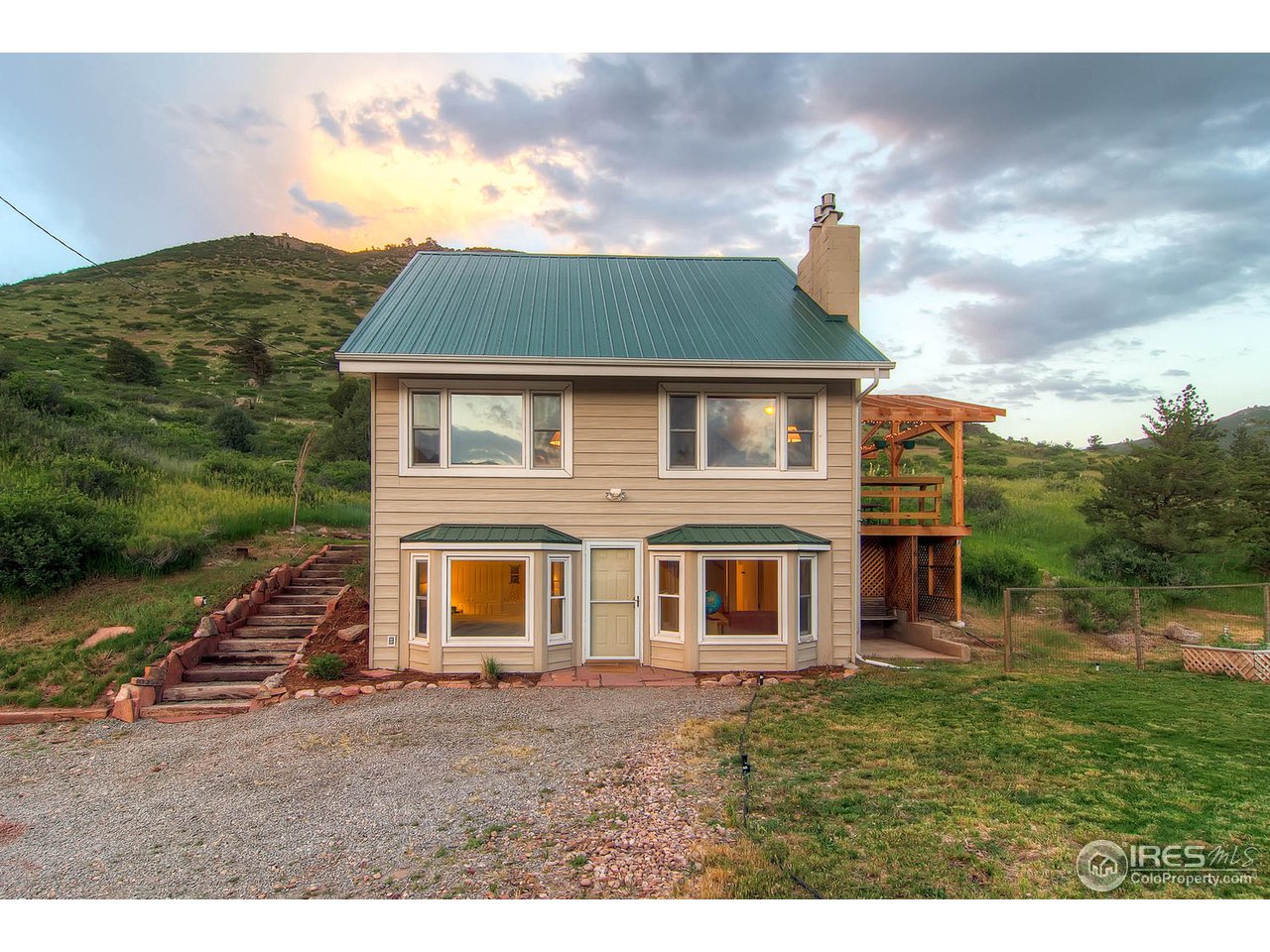427 Red Gulch Road Lyons, CO 80540 - Photo 2 of 25 a view of a house with a yard